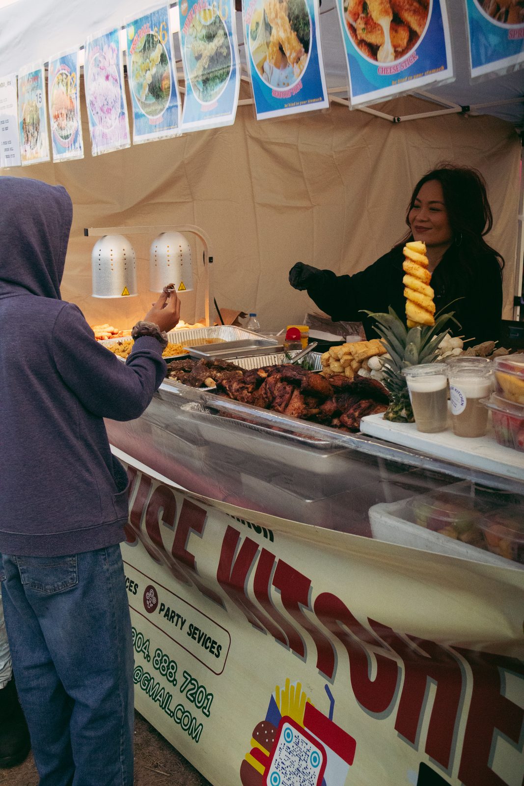 Filipino food vendor serving customers